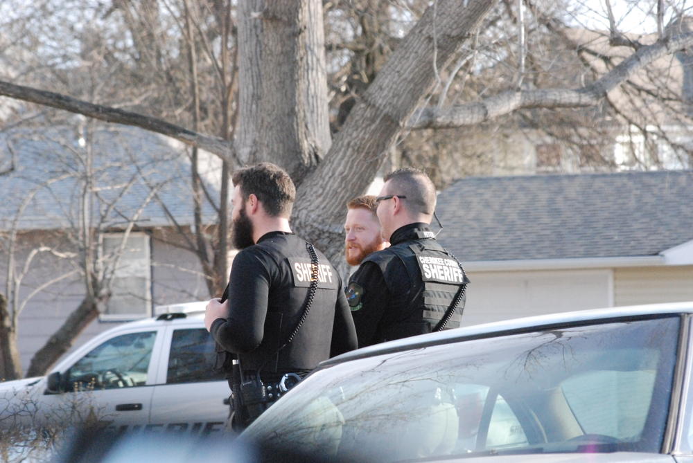 3 officers in uniform standing and talking