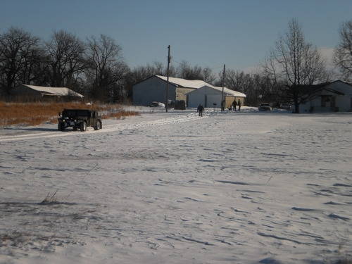 guardsmen helping a resident get their vehicle out of the snow