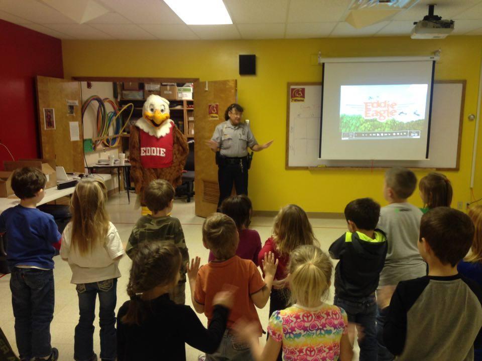 Deputy Anne Sharp and Eddie Eagle addressing a class of young students