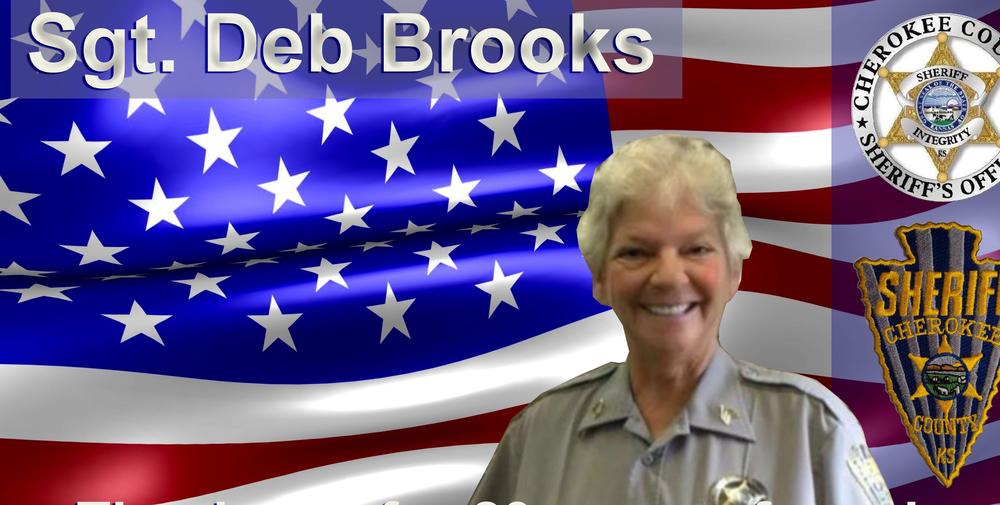 Sgt Deb Brooks on an American flag background