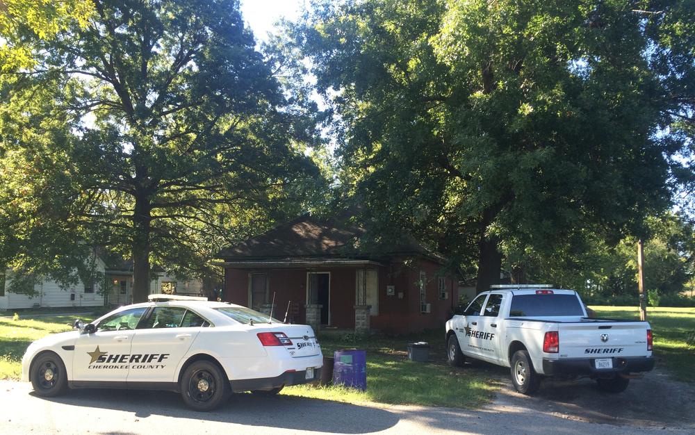 2 police vehicles on the scene of Monday's warrant