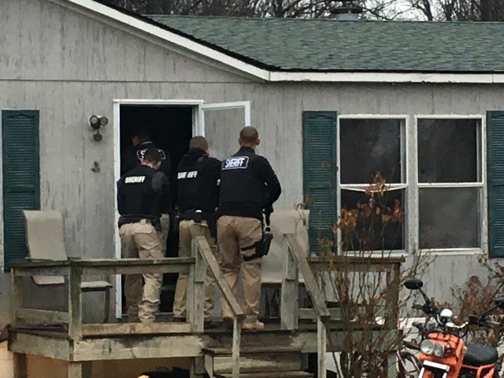 Officers entering residence